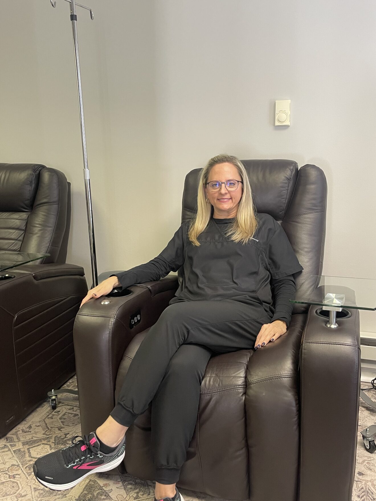Dr. Jill Skurnowicz, ND, CRNA, in the comfortable IV therapy room at Natural Care Institute